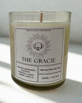 Candle with a label on a white surface