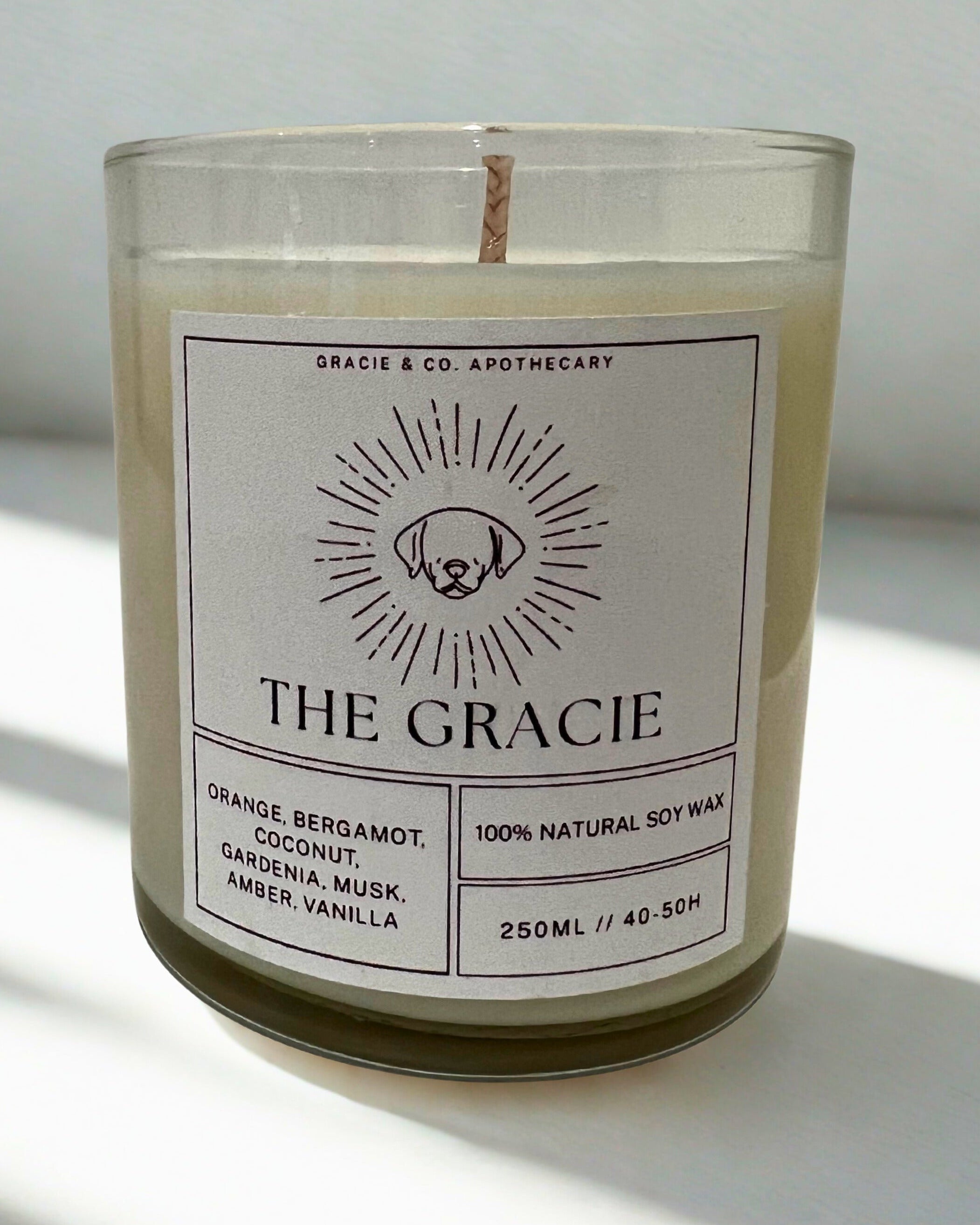Candle with a label on a white surface