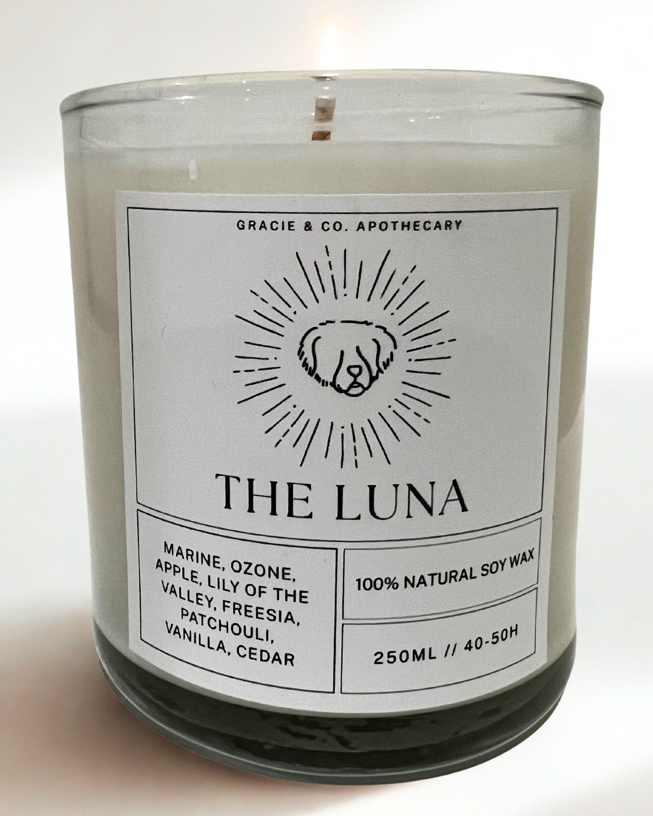 Candle labeled 'The Luna' with a white label on a white background